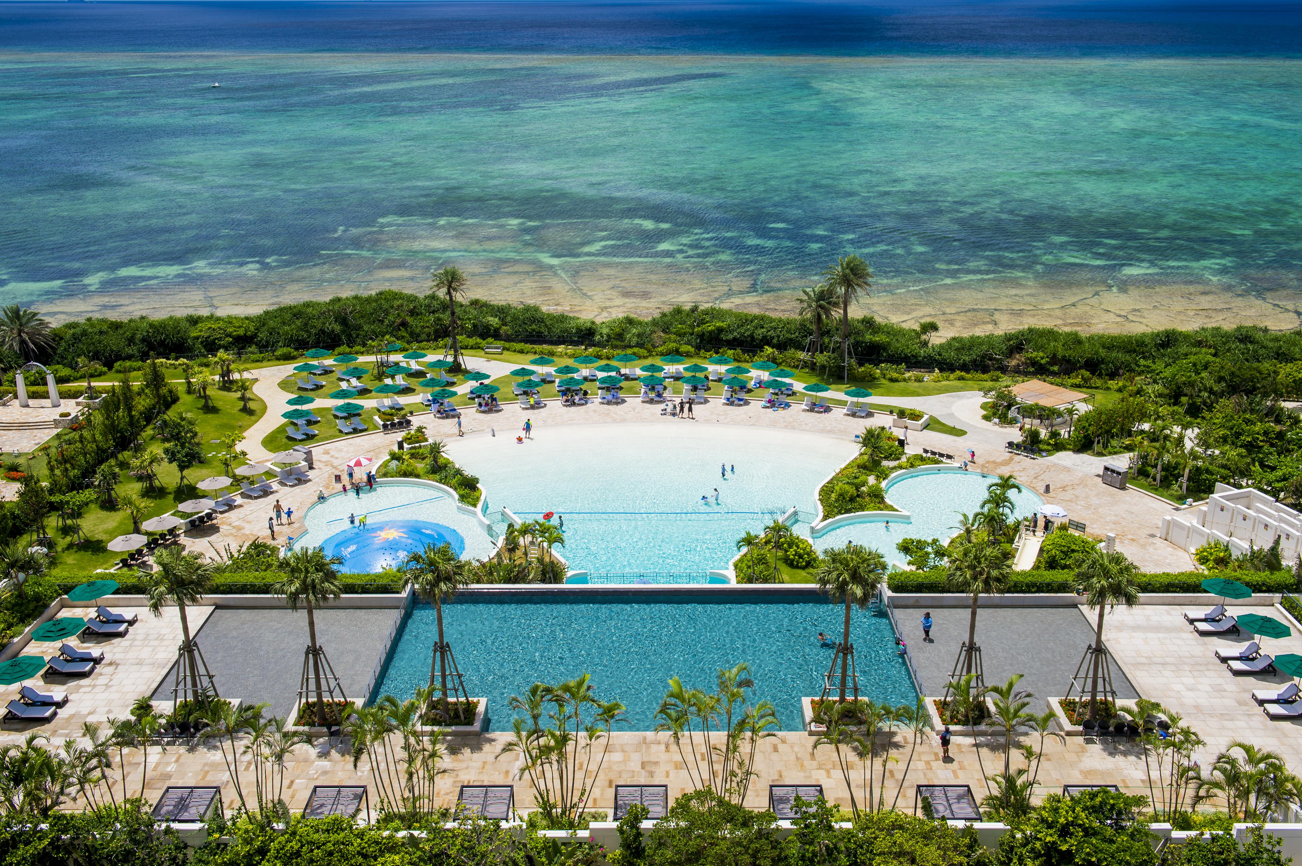 Hotel Monterey Okinawa Spa & Resort Onna Exterior photo Aerial view of the pool